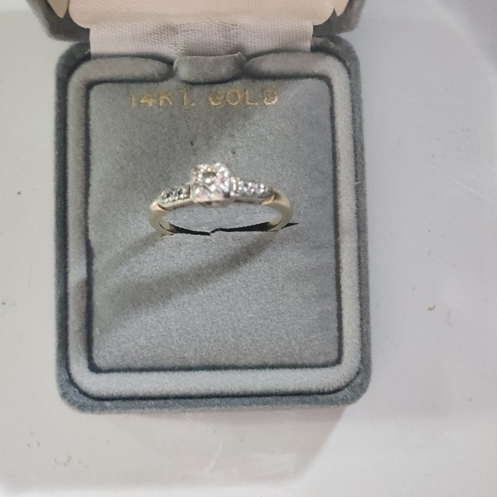 Genuine diamond engagement ring.  Size 5.  very old, yet beautiful